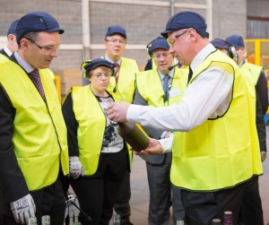 Kevin Donohue (right) explains the intricacies of glass decoration to guests at the opening of the new printing facility at Alloa.