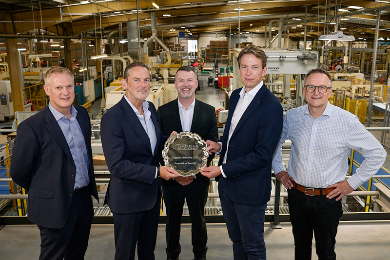 Board 24 receiving its Supplier of the Year award from Macfarlane Packaging