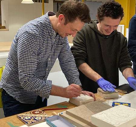 Paul Bynoth talking to a design student at Bath Spa University