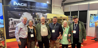 Group photo in front on packaging machinery