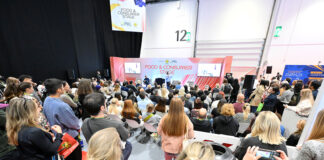 Conference session with speakers on stage