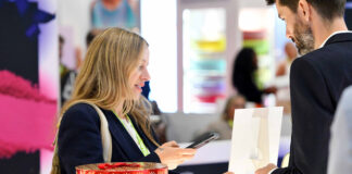 Packaging trade show visitor looking at exhibits