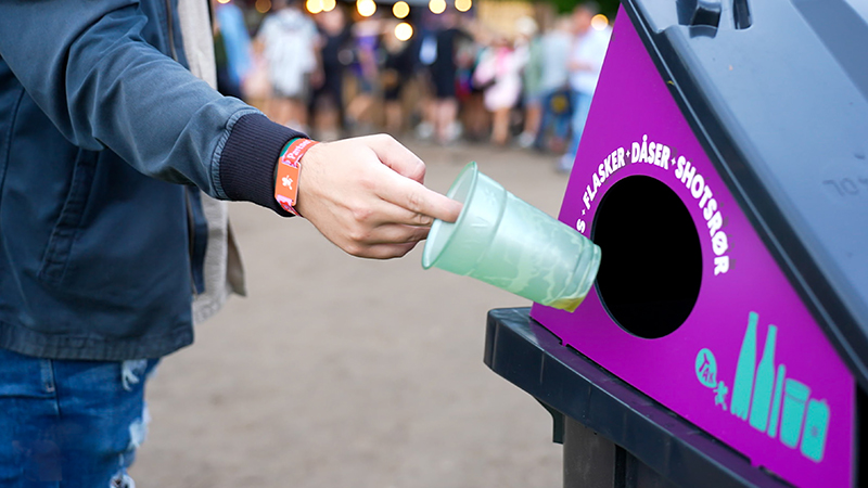 Cups being placed in collection point for recycling