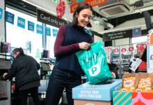 Coffee pods going into recycling container