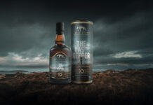 Whisky bottle with atmospheric background