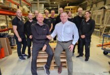 Sverre Stenbom (Left), Darren Chandler (Right), and RobotGrader Team (Back)