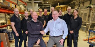 Sverre Stenbom (Left), Darren Chandler (Right), and RobotGrader Team (Back)