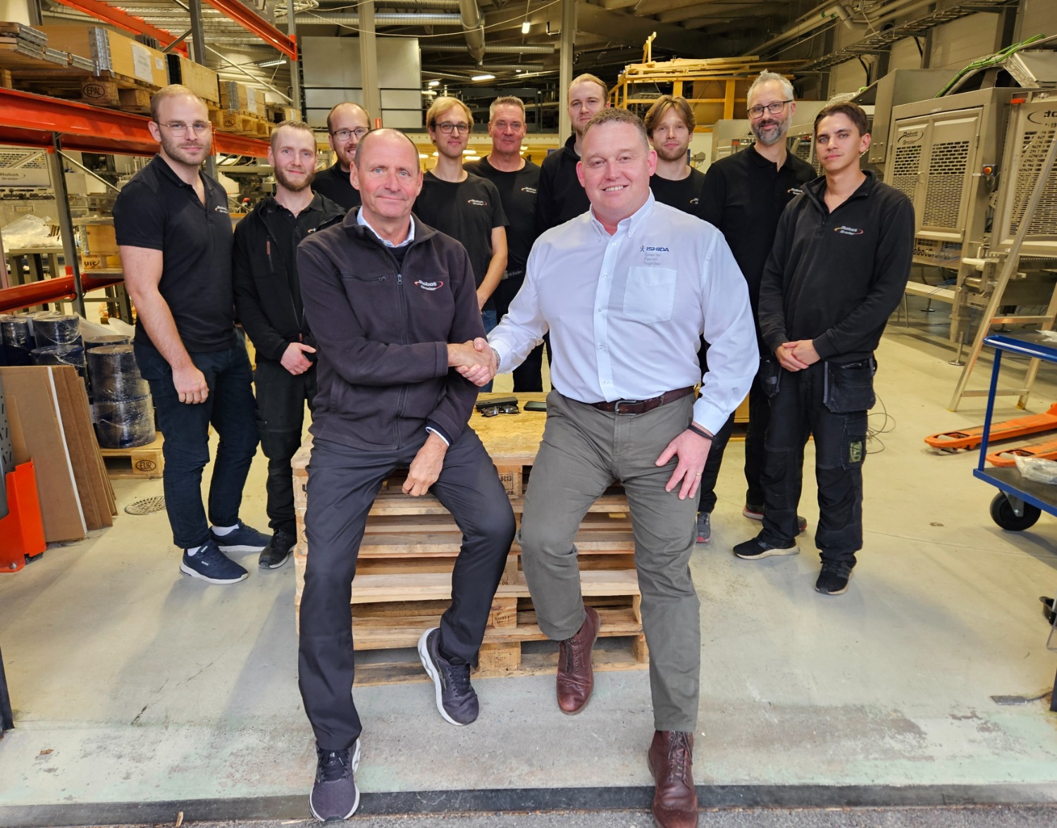 Sverre Stenbom (Left), Darren Chandler (Right), and RobotGrader Team (Back)