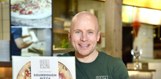 Roly Simpson, East Pizzas shows off the packaging