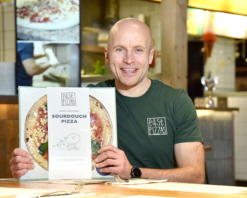 Roly Simpson, East Pizzas shows off the packaging