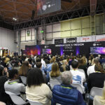 Conference stage with packed audience