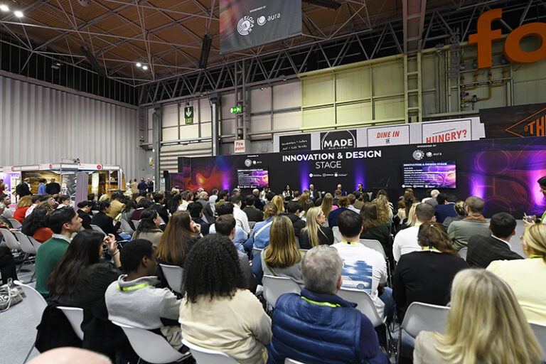 Conference stage with packed audience