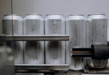 Aluminium cans being manufactured