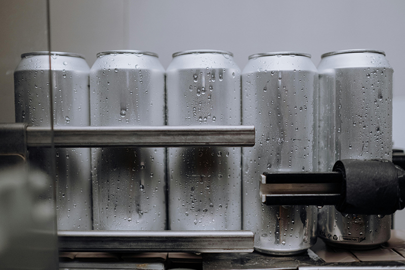 Aluminium cans being manufactured