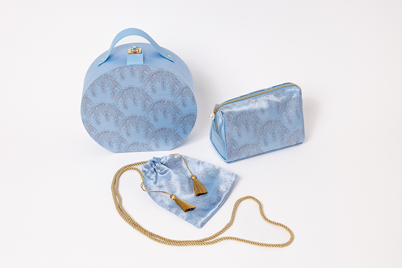 A vanity case, a cosmetics pouch, and a drawstring purse