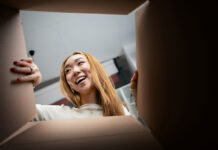 Consumer opening a box. Unboxing image