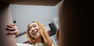 Consumer opening a box. Unboxing image