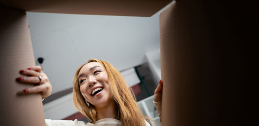 Consumer opening a box. Unboxing image