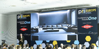 Busy conference session at trade exhibition