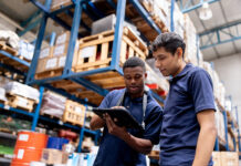Operatives using packaging software in warehouse environment