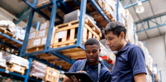 Operatives using packaging software in warehouse environment