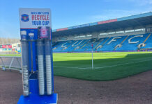 coffee cup collection inside football stadium