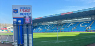 coffee cup collection inside football stadium