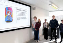 Students with image of Undergraduate Can of the Year award winner
