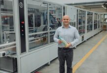 Frugalpac unveils high-speed paper bottle machine Fruglapac Product Director JP Grogan and the new Frugal Bottle Assembly Machine 2 (FBAM-2)