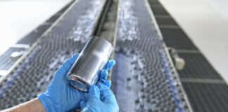 Worker holding aluminium can