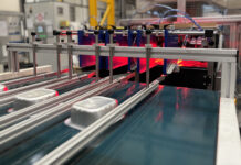 Trays being inspected on production line