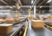 Why corrugated packaging is the unsung hero of global trade Cardboard boxes on conveyor belts